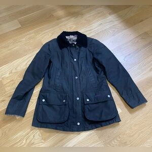 Barbour Women’s Black Iconic Waxed Jacket in US Size 4. In great condition.